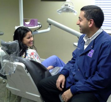 Dentist talking With Patient