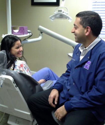 Dentist talking With Patient